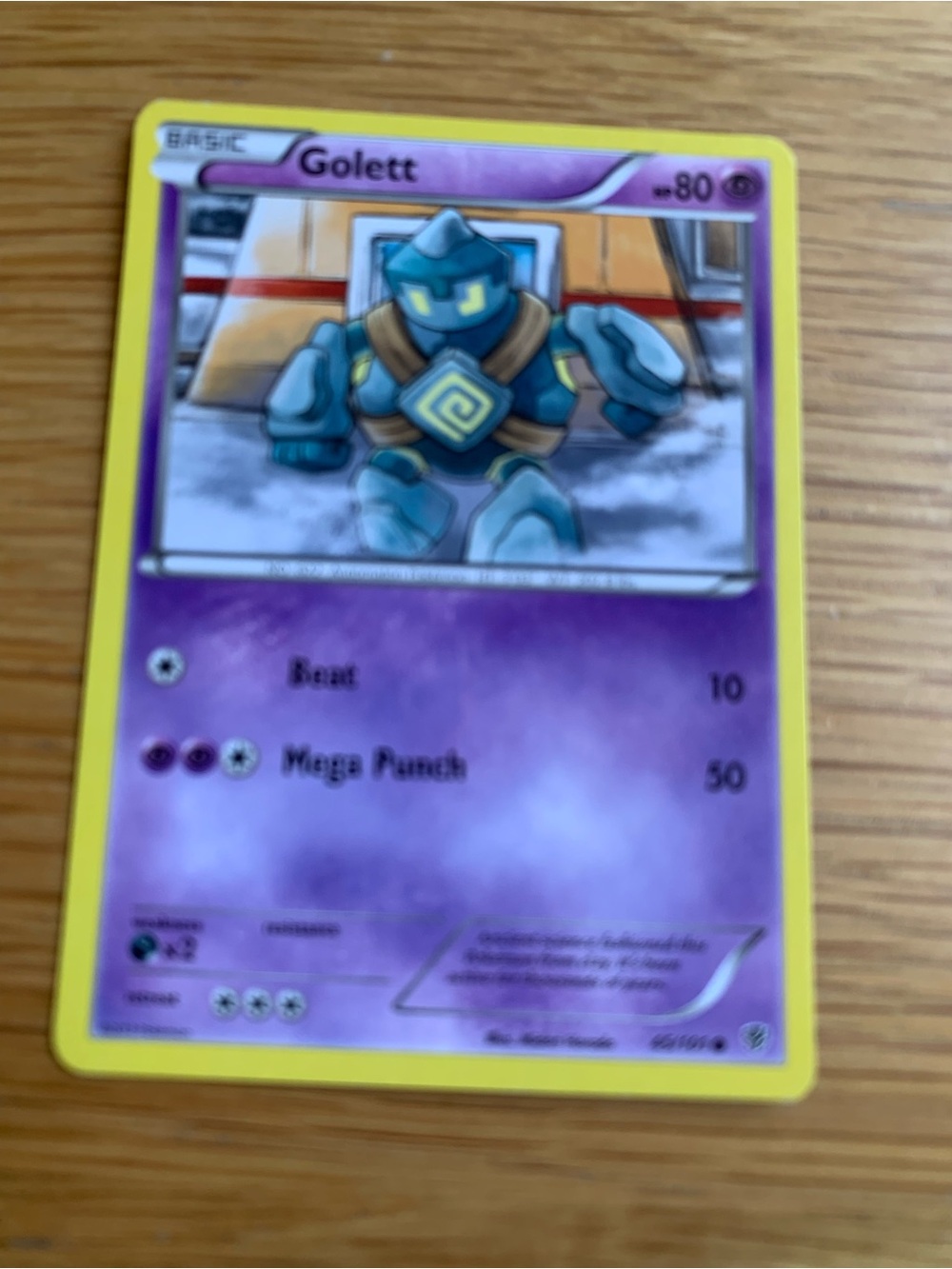 Pokemon Golett Card - Purple Artwork with Yellow Border
